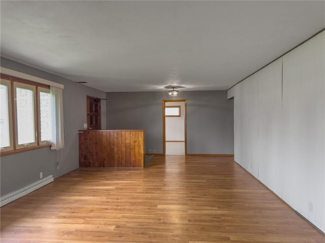 1511 E Fayette Ave, Teutopolis, IL 62467 - unfurnished room featuring light wood-type flooring and baseboard heating