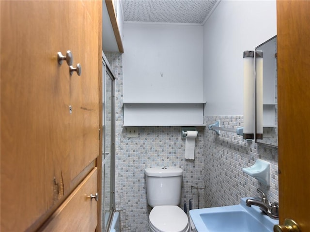 1511 E Fayette Ave, Teutopolis, IL 62467 - bathroom featuring an enclosed shower, tile walls, and tasteful backsplash
