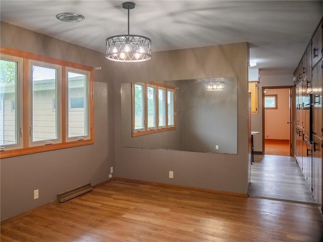 1511 E Fayette Ave, Teutopolis, IL 62467 - unfurnished room featuring plenty of natural light and light wood-style flooring