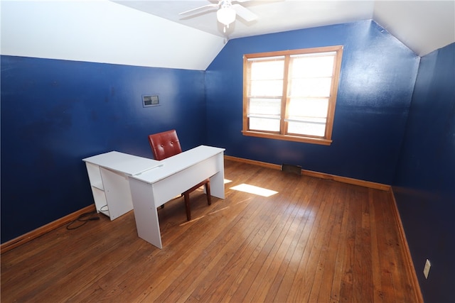 unfurnished office with hardwood / wood-style floors, vaulted ceiling, and ceiling fan