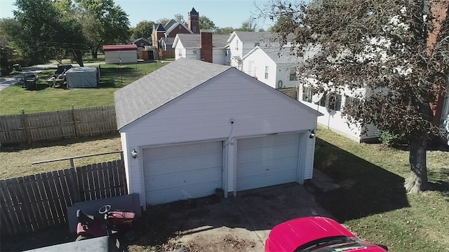 garage featuring a lawn