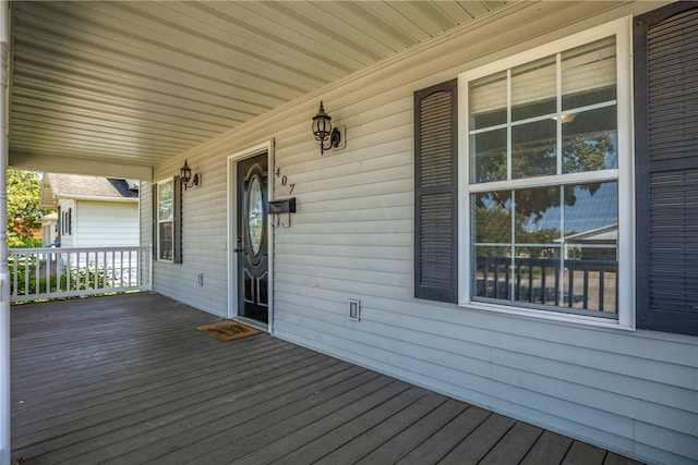 wooden deck featuring covered porch