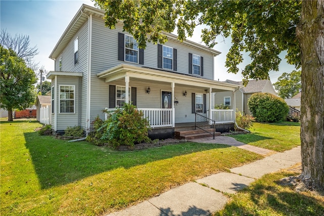 view of front of property with a front lawn and covered porch