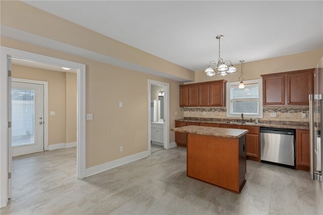 kitchen with dishwasher, a center island, a wealth of natural light, and backsplash