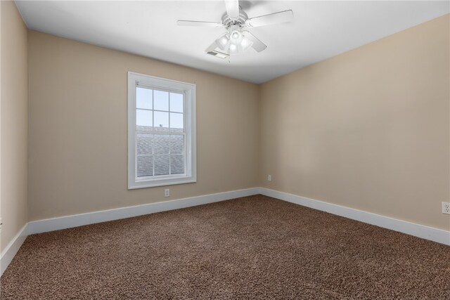 spare room with carpet flooring and ceiling fan