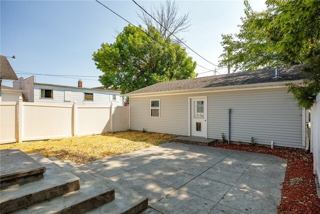 rear view of house with a patio