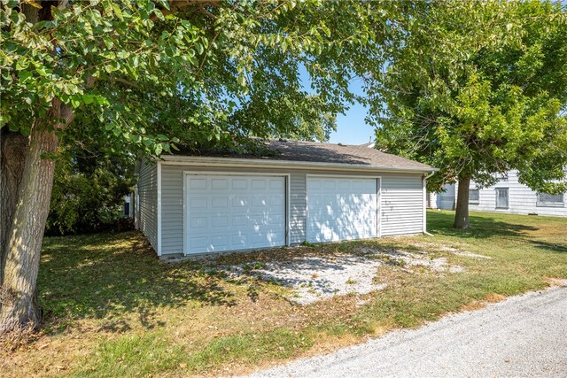 garage with a lawn