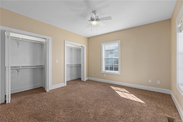 unfurnished bedroom with carpet floors and ceiling fan