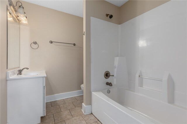 full bathroom with tile patterned flooring, vanity, shower / bath combination, and toilet