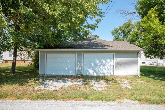 garage with a lawn