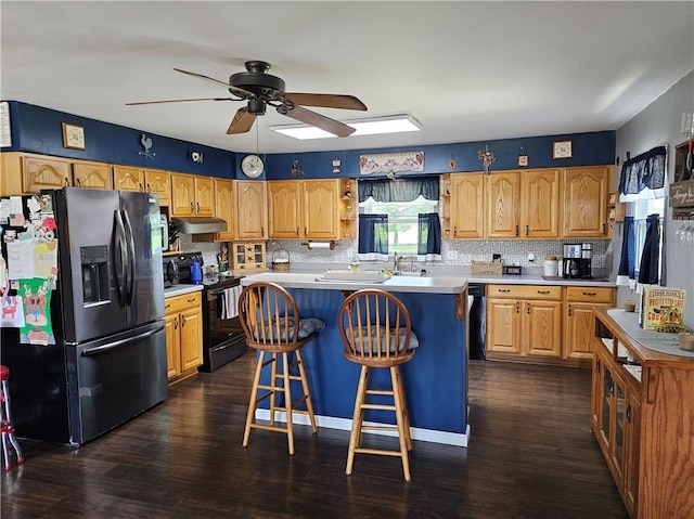 308 S Missouri St, Toledo, IL 62468 - kitchen featuring black appliances, ceiling fan, under cabinet range hood, and tasteful backsplash