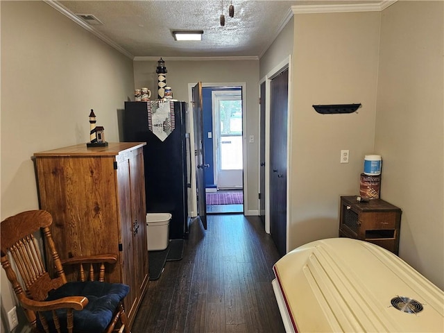 308 S Missouri St, Toledo, IL 62468 - bedroom featuring dark wood finished floors, a textured ceiling, and ornamental molding