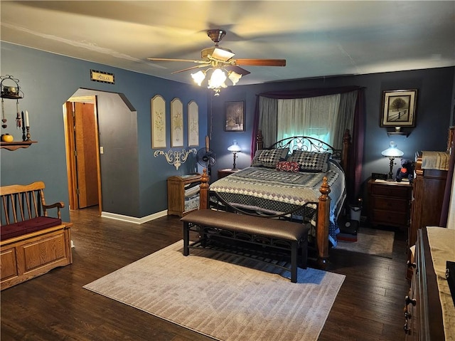 308 S Missouri St, Toledo, IL 62468 - bedroom with wood finished floors, arched walkways, and a ceiling fan