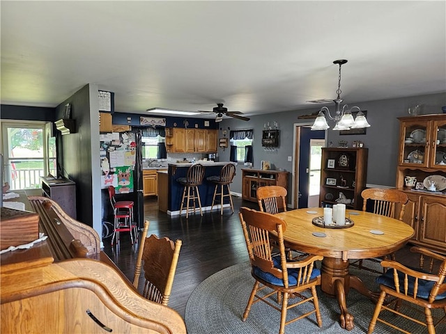 308 S Missouri St, Toledo, IL 62468 - dining space featuring dark wood-style flooring, plenty of natural light, a chandelier, and a ceiling fan