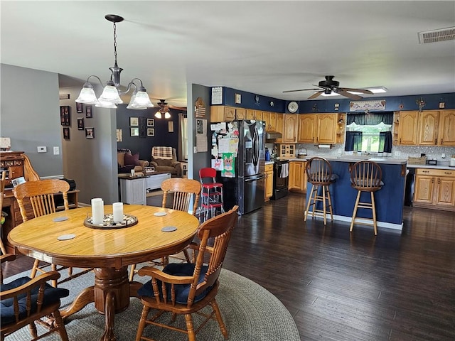 308 S Missouri St, Toledo, IL 62468 - dining area with a ceiling fan and dark wood-style flooring