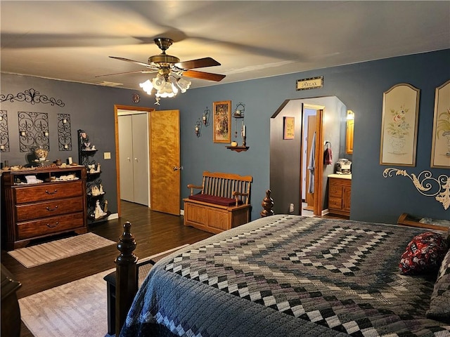 308 S Missouri St, Toledo, IL 62468 - bedroom featuring arched walkways, wood finished floors, and ceiling fan