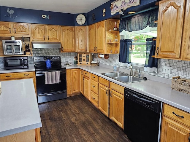 308 S Missouri St, Toledo, IL 62468 - kitchen featuring black appliances, under cabinet range hood, decorative backsplash, light countertops, and dark wood-type flooring
