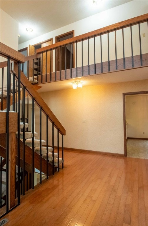 staircase featuring wood-type flooring