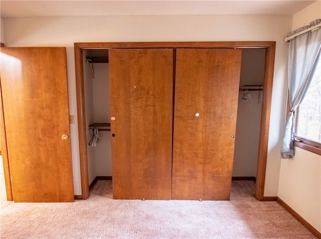 unfurnished bedroom with light colored carpet