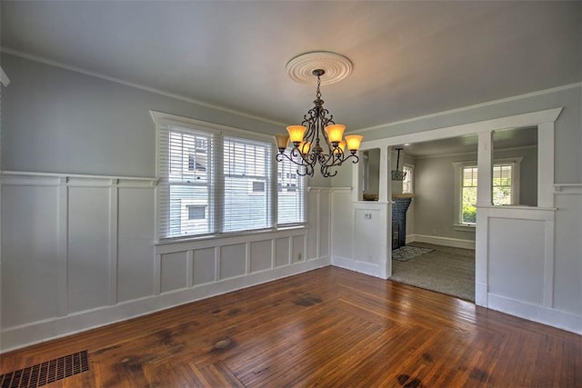 1470 W Decatur St, Decatur, IL 62522 - unfurnished dining area featuring a decorative wall, wainscoting, a chandelier, ornamental molding, and a fireplace with flush hearth