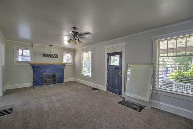 1470 W Decatur St, Decatur, IL 62522 - entrance foyer with a ceiling fan, crown molding, carpet flooring, and a fireplace