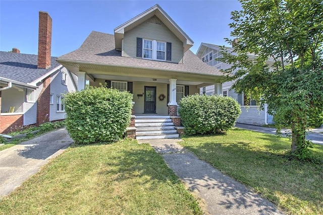 1470 W Decatur St, Decatur, IL 62522 - bungalow-style house featuring a front lawn, covered porch, and roof with shingles