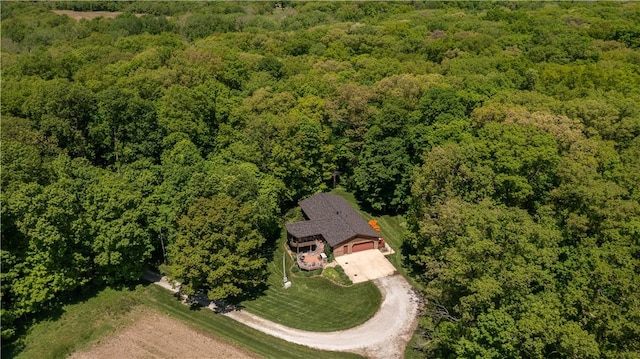 view of subject property featuring a forest
