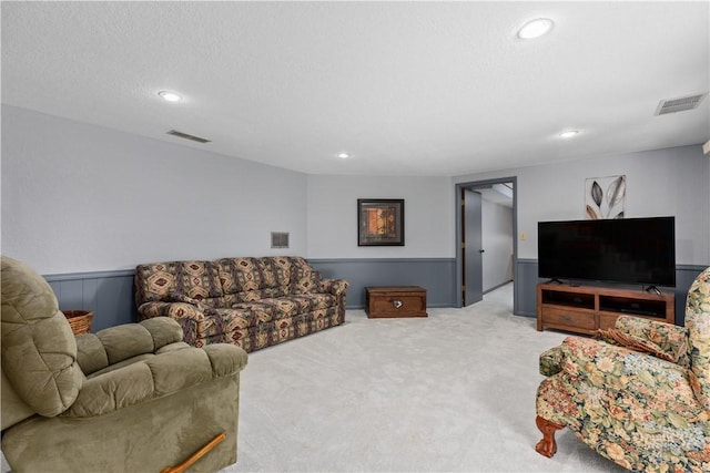 carpeted living room with recessed lighting