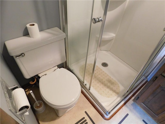 205 Monroe St, Toledo, IL 62468 - bathroom featuring a shower stall and toilet