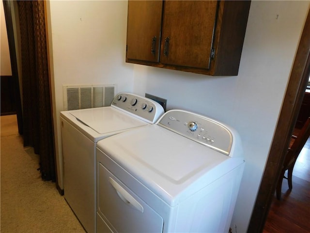 205 Monroe St, Toledo, IL 62468 - laundry area featuring independent washer and dryer and cabinet space