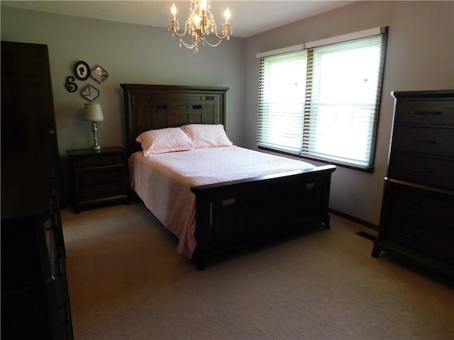 205 Monroe St, Toledo, IL 62468 - bedroom featuring light colored carpet and a chandelier