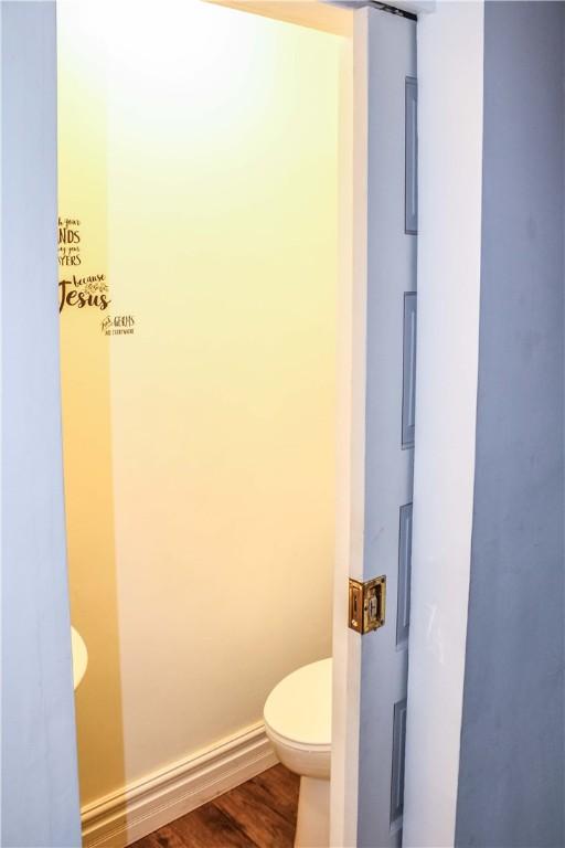 3416 Western Ave, Mattoon, IL 61938 - bathroom featuring toilet and wood finished floors