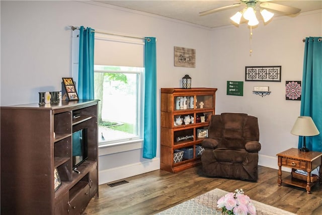 3416 Western Ave, Mattoon, IL 61938 - living area with baseboards, ceiling fan, wood finished floors, and crown molding
