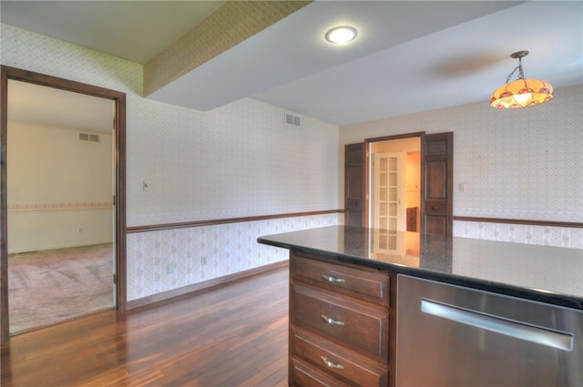 1225 W Pineview Ct, Decatur, IL 62526 - kitchen with wallpapered walls, stainless steel dishwasher, dark wood finished floors, and hanging light fixtures