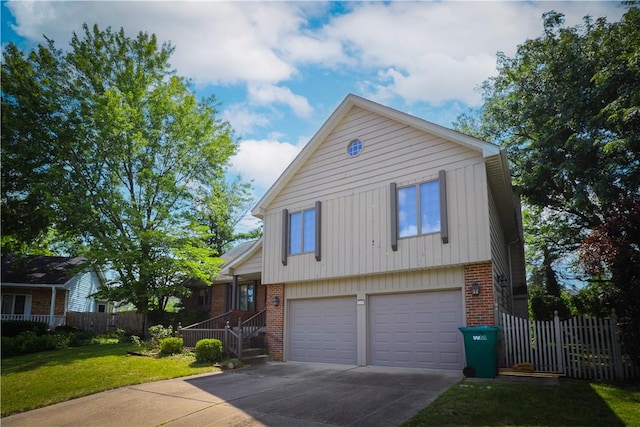 1225 W Pineview Ct, Decatur, IL 62526 - tri-level home with brick siding, a garage, and driveway