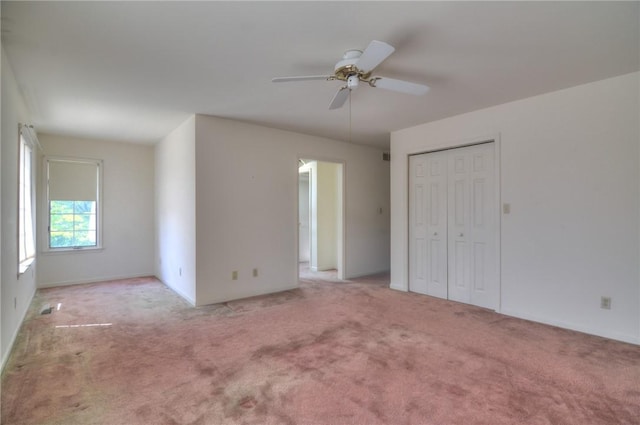 1225 W Pineview Ct, Decatur, IL 62526 - unfurnished bedroom with carpet, ceiling fan, and a closet