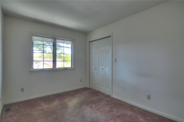 1225 W Pineview Ct, Decatur, IL 62526 - unfurnished bedroom featuring carpet and a closet
