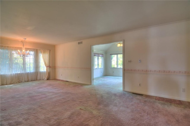 1225 W Pineview Ct, Decatur, IL 62526 - empty room with a chandelier and carpet flooring