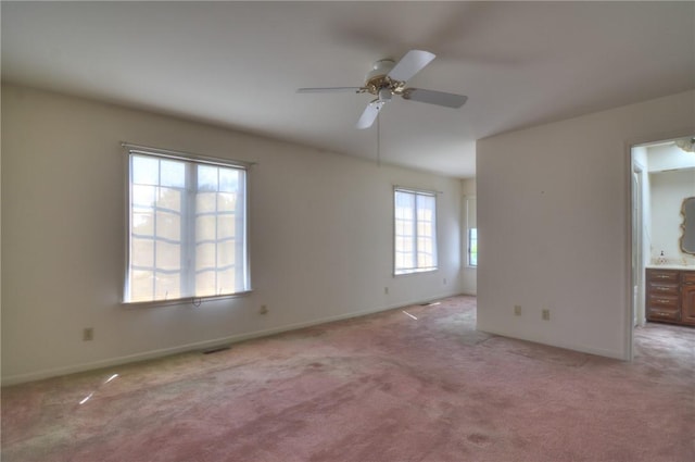 1225 W Pineview Ct, Decatur, IL 62526 - empty room with light colored carpet and a ceiling fan