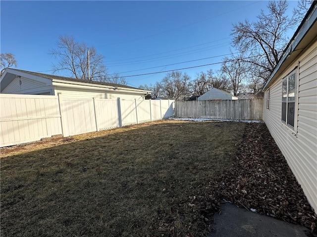 view of yard with a fenced backyard