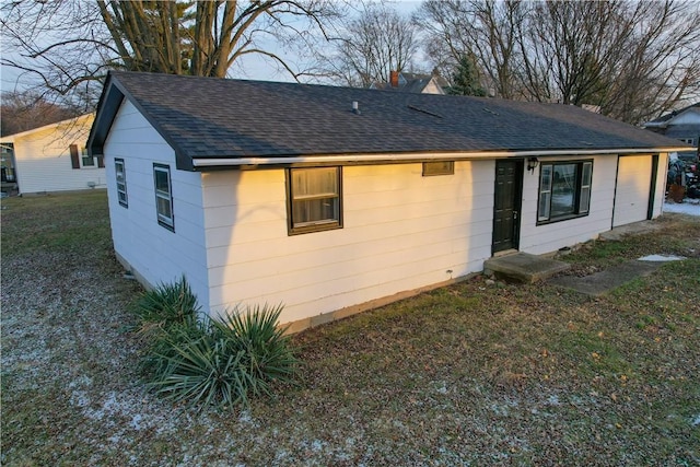 rear view of house with a yard