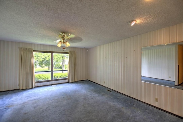 3103 N Oakland Ave, Decatur, IL 62526 - empty room featuring ceiling fan, a textured ceiling, and carpet