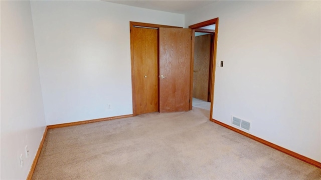 29 Peckerwood Ct, Bethany, IL 61914 - empty room with baseboards, visible vents, and light colored carpet