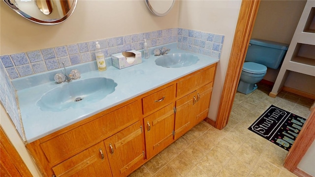 29 Peckerwood Ct, Bethany, IL 61914 - bathroom with double vanity, toilet, and a sink