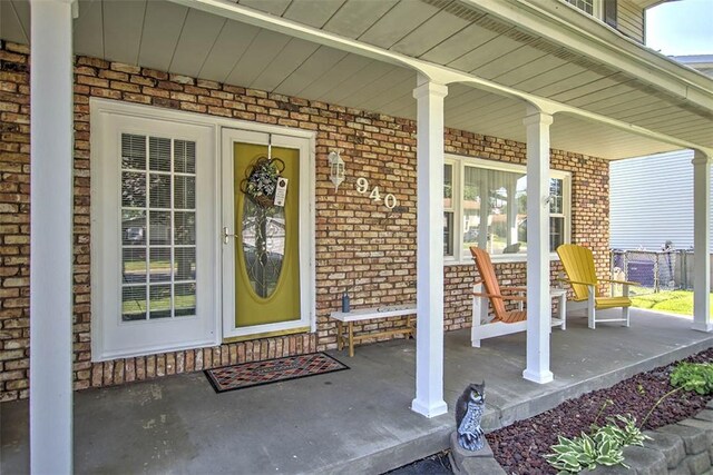 940 Kirk Dr, Mt Zion, IL 62549 - entrance to property featuring covered porch and brick siding