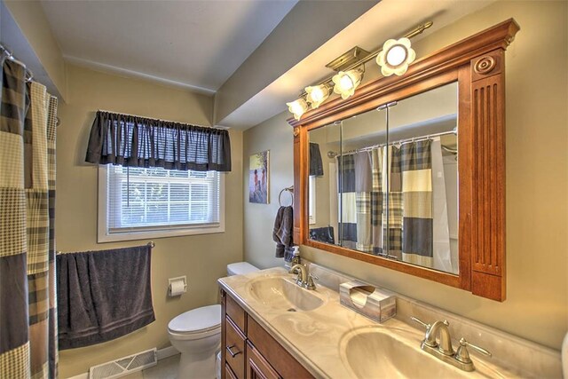 940 Kirk Dr, Mt Zion, IL 62549 - bathroom with double vanity and a shower with shower curtain