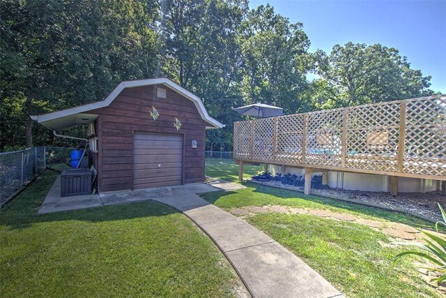 940 Kirk Dr, Mt Zion, IL 62549 - view of yard featuring an outdoor structure, a garage, and driveway