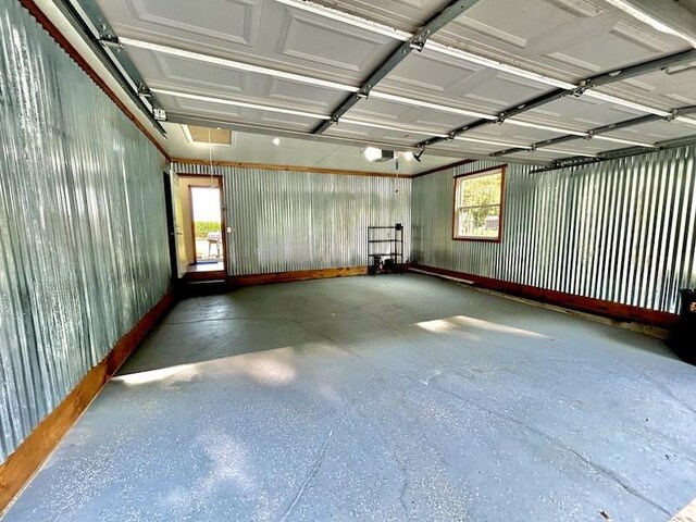 20786 Heritage Ln, Marshall, IL 62441 - garage featuring a garage door opener and metal wall