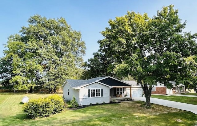 20786 Heritage Ln, Marshall, IL 62441 - view of front of house featuring an attached garage, concrete driveway, and a front yard