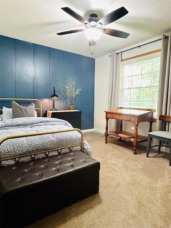 20786 Heritage Ln, Marshall, IL 62441 - carpeted bedroom featuring a decorative wall, a ceiling fan, and a textured ceiling